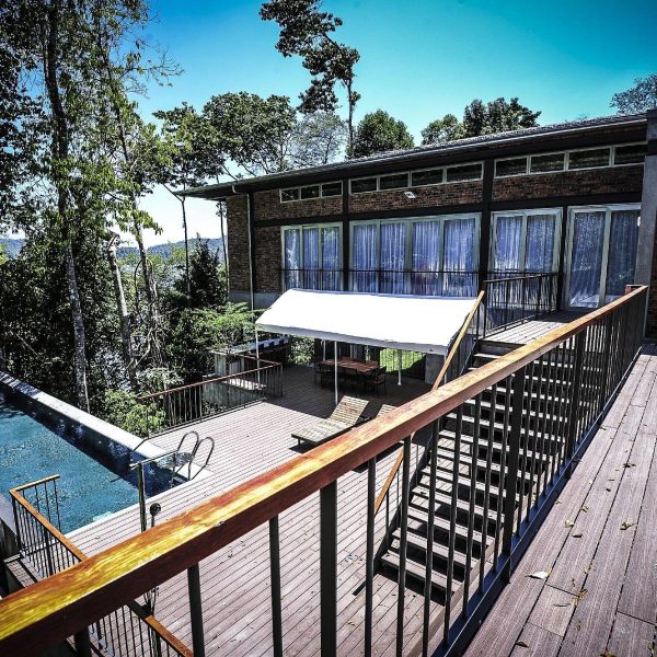 An exterior shot of the Belum Rainforest Resort in Malaysia, recommended by JourneyWoman readers as a safe place for women to stay.