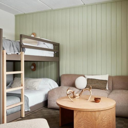 A room with bunk beds and a view at the Bluebird Lake Placid Hotel in Lake Placid, New York.