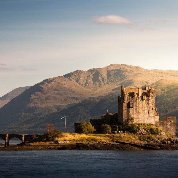 Contemplating the iconic Eilean Donan Castle that sits on an island - Ireland & Scotland’s Gems - Brendan Vacations