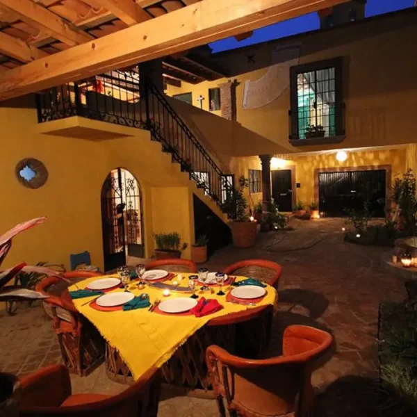 The dining and seating areas of the Casa las Palomas vacation rental apartment in San Miguel de Allende Mexico, recommended by a JourneyWoman reader as a safe place to stay.