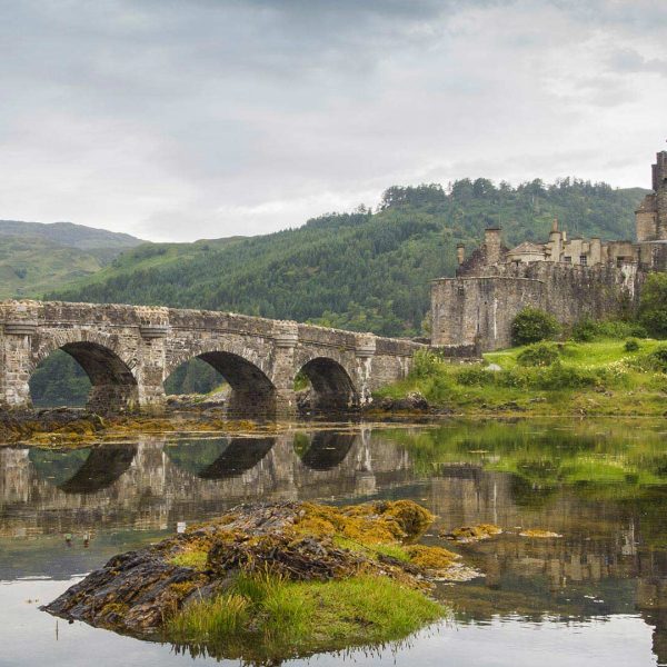 Eilean Donan Castle in the Scottish Highlands, a historical site visit on the Scotland and the Highlands Tour by Women Traveling the World