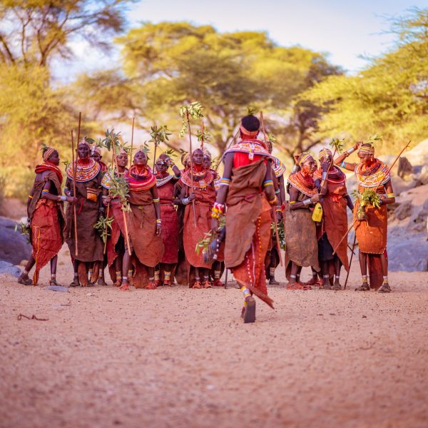 Samburu tribe members are lining up for a group photograph - Safari Retreat in Kenya - Oculus Travel