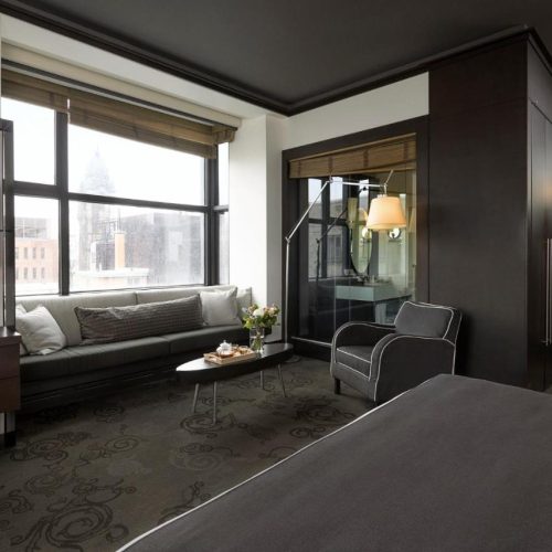 A dark bedroom suite at the Le Germain Hotel in Quebec, recommended as a safe place for women to stay.