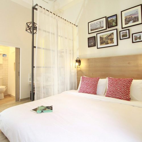 A simply decorated private room with a queen sized bed at the Lub D hostel in Phuket. HostelWorld