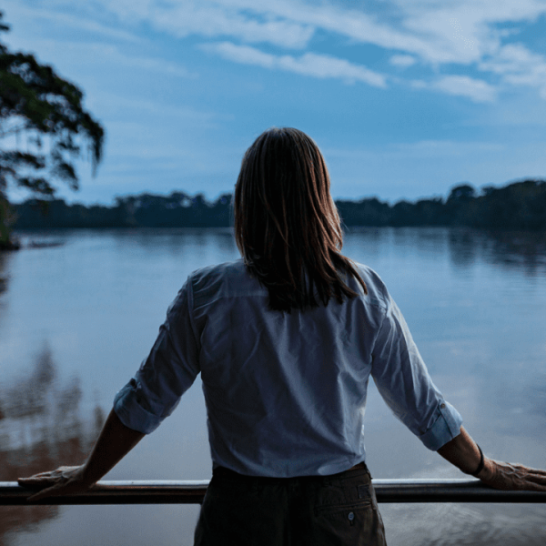Women gazing out over the Napo River, surrounded by lush greenery and the beauty of nature - 9-Day Ecuador Amazon Female Travel - Rebecca Adventure Travel