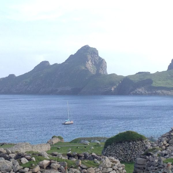 Scenic view of St Kilda's waters, featuring rugged cliffs and open sea, part of the route we'll navigate during the tour Outer Hebrides Explorer.