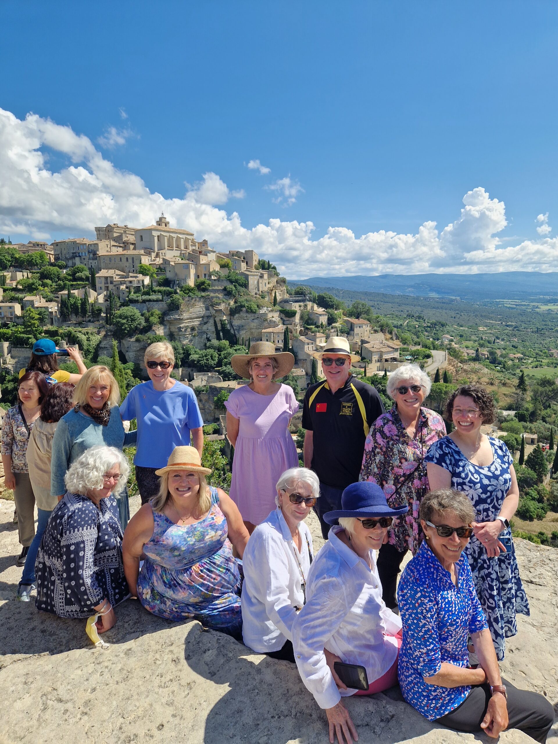 A group of women pose together for a photo in the South of France - Provence Excited about Food Tour - Absolutely Southern France
