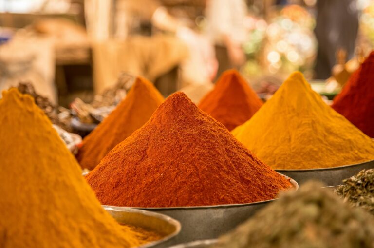 Photo showcasing the vibrant mounds of colorful spices.