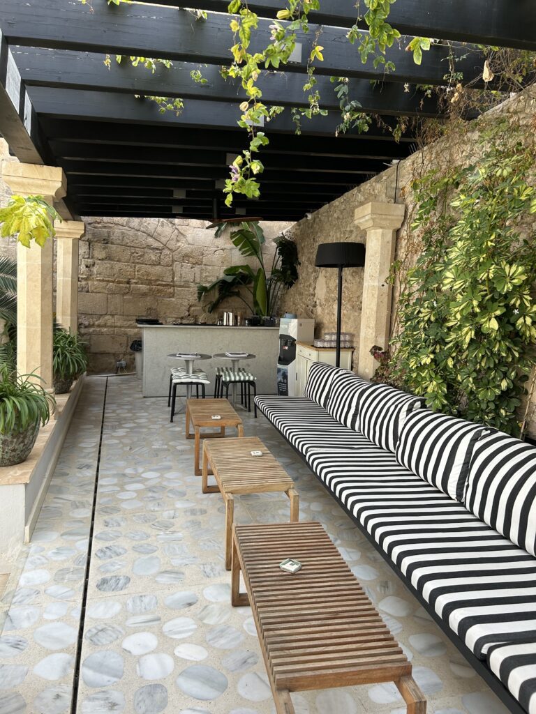 A long and inviting patio area at the Concepcio by Nobis in Mallorca, Spain, recommended as a safe place for women to stay.