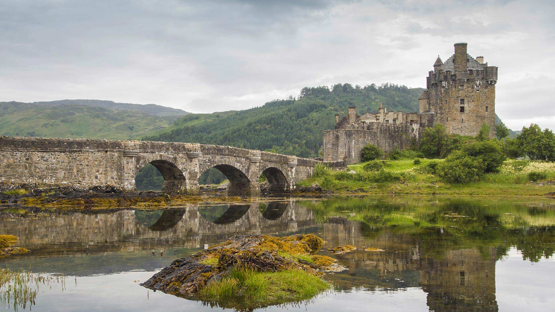 Eilean Donan Castle in the Scottish Highlands, a historical site visit on the Scotland and the Highlands Tour by Women Traveling the World