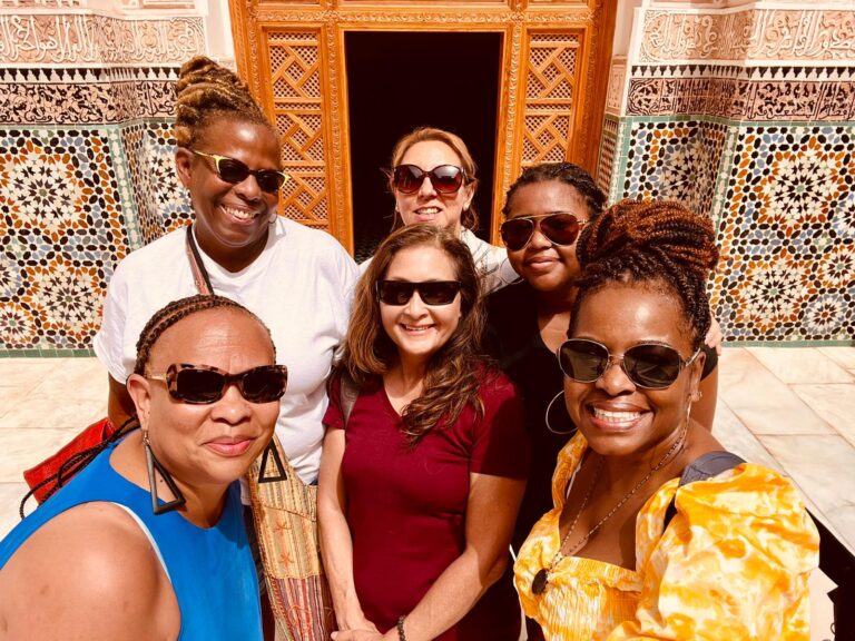 A group of women exploring the vibrant Majorelle Gardens, surrounded by lush greenery and iconic blue architecture - Morocco's Golden Triangle: Marrakech, Agafay & Essaouira