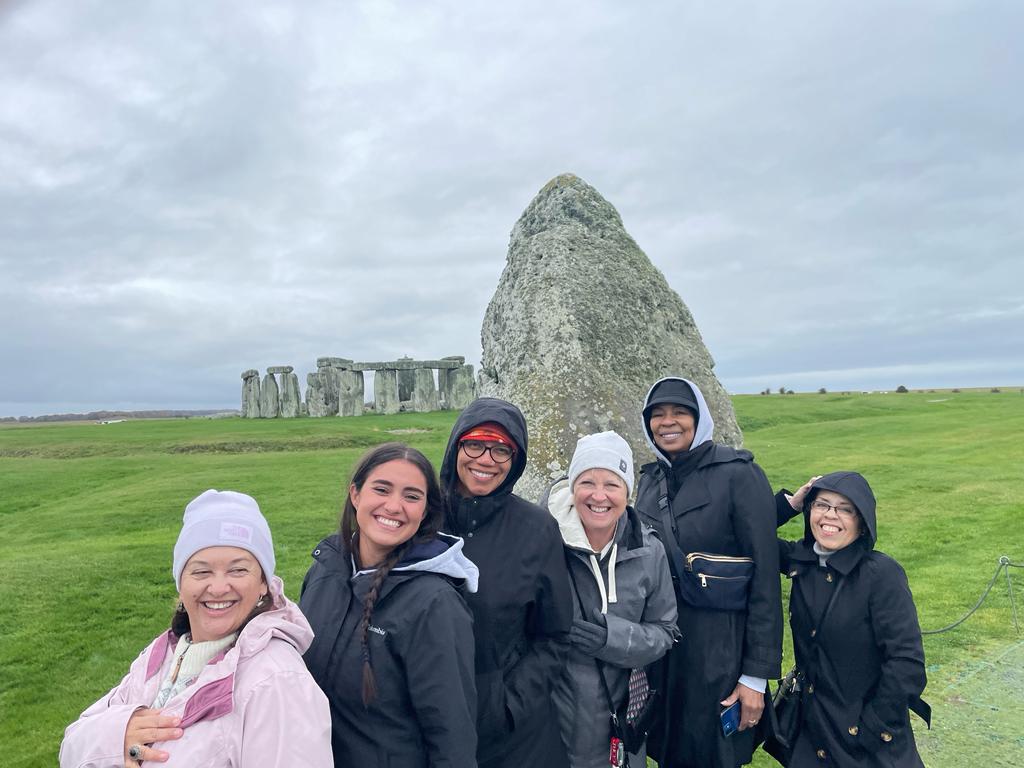 Tour participants exploring the iconic Stonehenge monument.