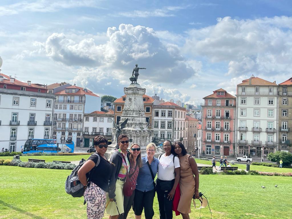 Women celebrating the end of their profound achievement of the Camino -