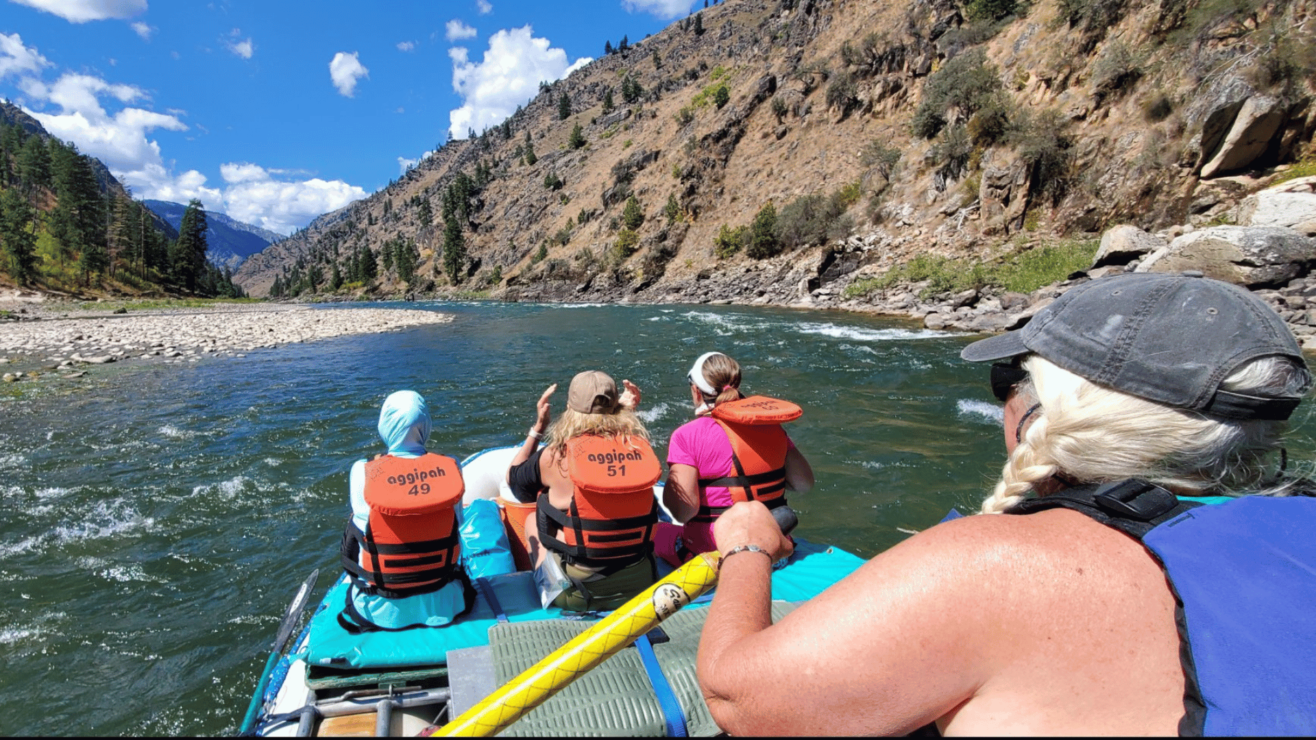 Women paddling together on a thrilling rafting adventure - Idaho Main Salmon River Rafting Tour