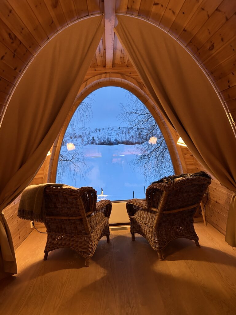 a picturesque view of the tundra from a room in at the SnowHotel Kirkenes in Norway, recently recommended as a safe place to stay for women by a JourneyWoman reader.