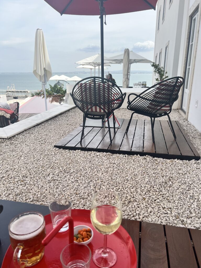 A patio with views of the coast at the Memmo Alfama Hotel in Lisbon, Portugal, recommended as a safe place for women to stay.