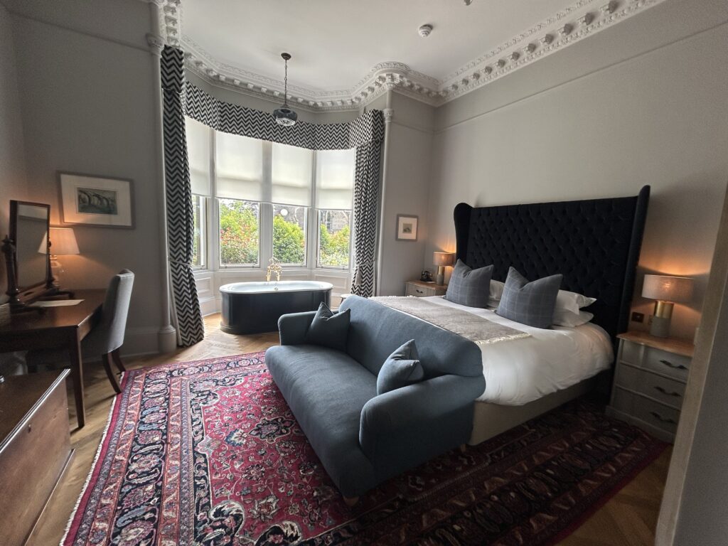 Boutique suite with bay window at the Roseate House Hotel in London, England, recommended as a safe place for women to stay.