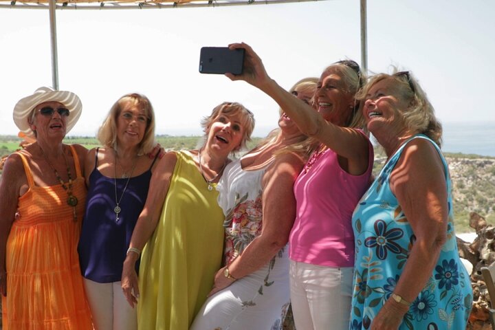 A group of women enjoying a moment of the tour In the Footsteps of Aphrodite: Western Cyprus.